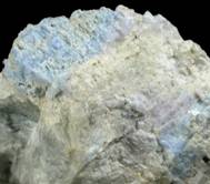 Mineral Specimens: Carletonite (MSH UK-15) in Pectolite from Poudrette Quarry, Mont Saint-Hilaire, Qubec, Canada